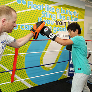 two people sparring in the boxing ring