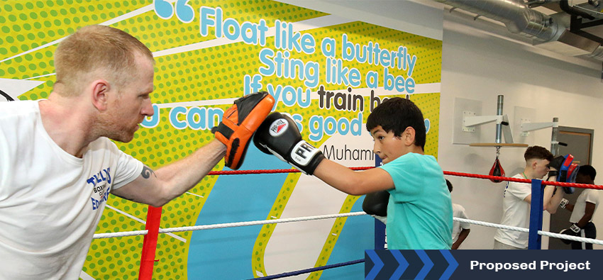 two people sparring in the boxing ring